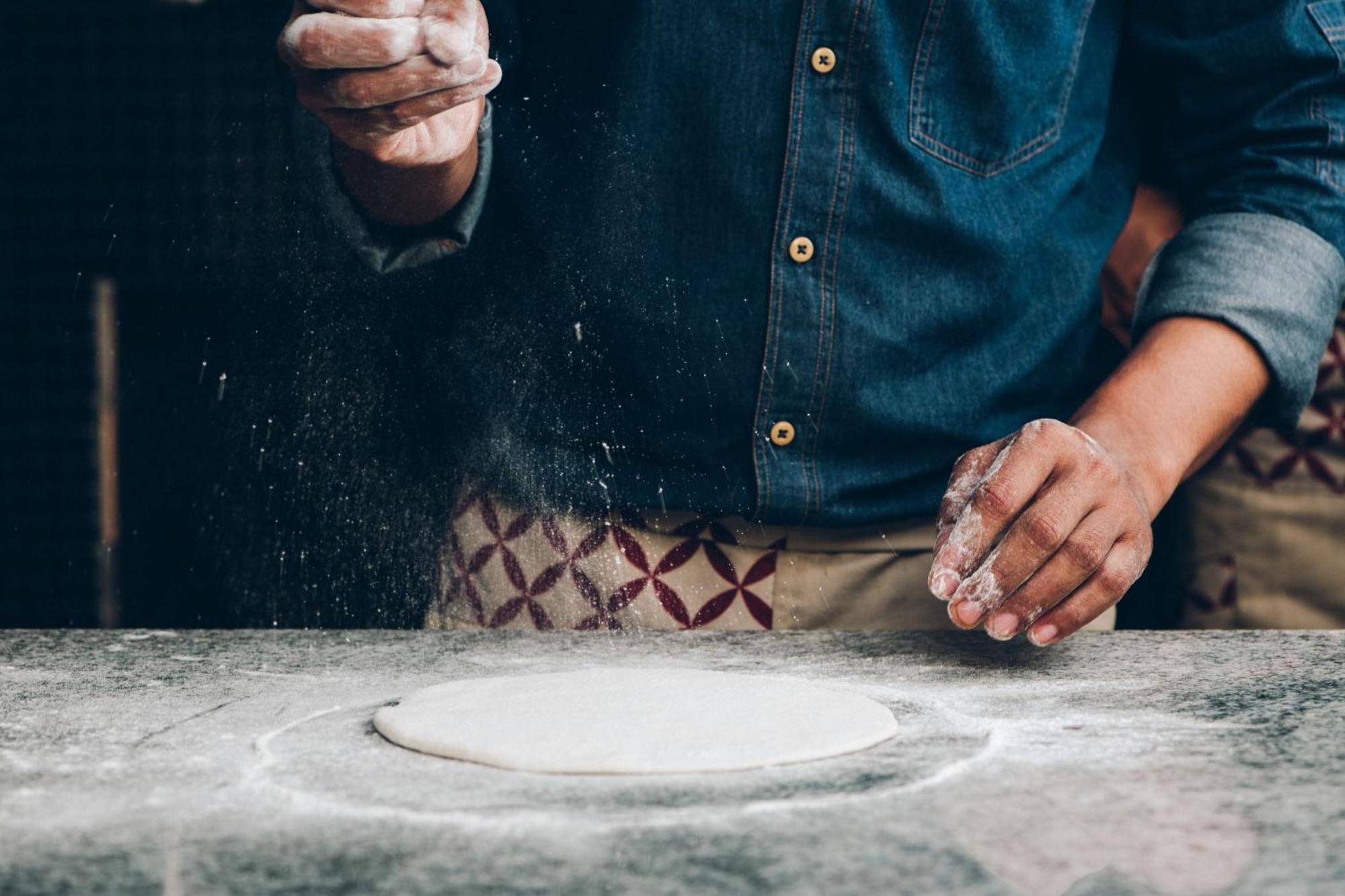 Hyatt Centric Candolim Goa Exterior foto A baker preparing bread dough